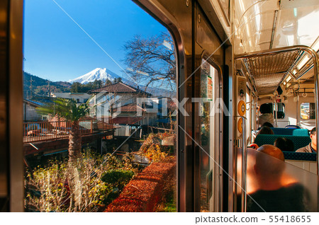Snow covered Mount Fuji and local town along train Snow covered Mount Fuji and local town along train 55418655