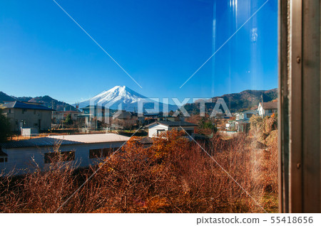 Snow covered Mount Fuji and local town along train Snow covered Mount Fuji and local town along train 55418656