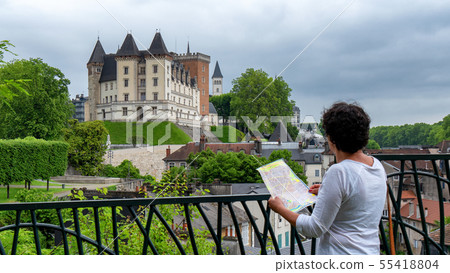 woman visiting castle of Pau city in France 55418804