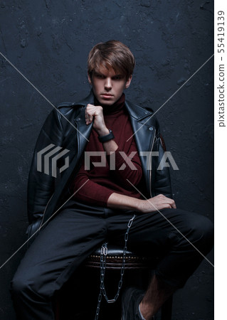 Young fashionable man in a retro style jacket  55419139