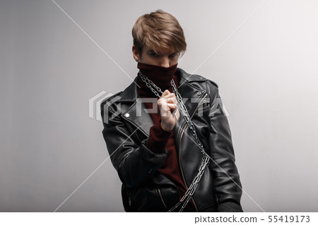 Young man with a fashionable hairstyle in red golf 55419173