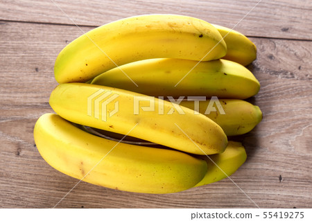 bananas on the wooden table 55419275