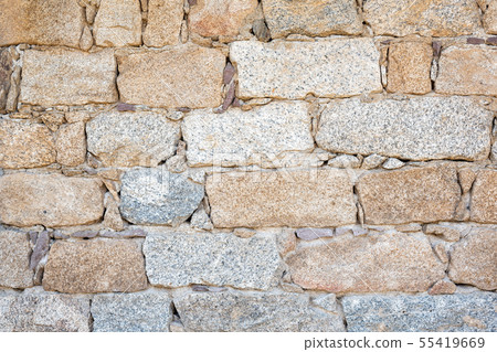 Texture of an irregular stone wall. Background. Texture of an irregular stone wall. Background. 55419669