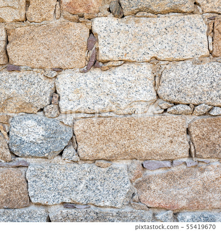 Texture of an irregular stone wall. Background. 55419670