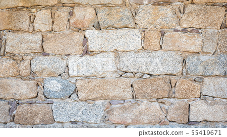 Texture of an irregular stone wall. Background. 55419671