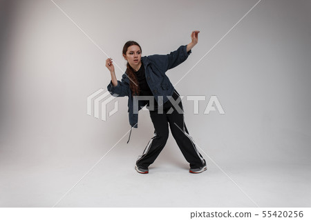 Charming young cute woman dancer in blue jacket 55420256