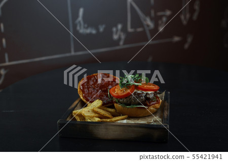 Delicious juicy hamburger with white golden buns Delicious juicy hamburger with white golden buns 55421941