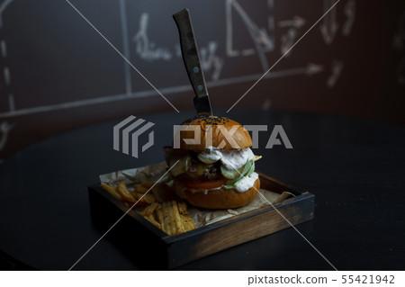 Delicious hamburger with white golden buns  55421942