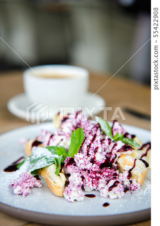Warm waffles with cottage cheese and currant jam Warm waffles with cottage cheese and currant jam 55422908