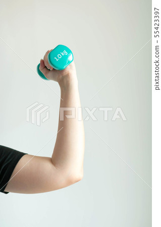 Close-up image of left woman hand lifting dumbbell Close-up image of left woman hand lifting dumbbell 55423397