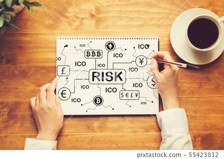 Cryptocurrency ICO risk theme with a person writing in a notebook Cryptocurrency ICO risk theme with a person writing in a notebook 55423812