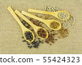 Different kinds of dry herbs in wooden spoon. 55424323