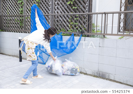 Woman dumping trash 50s 60s 55425374