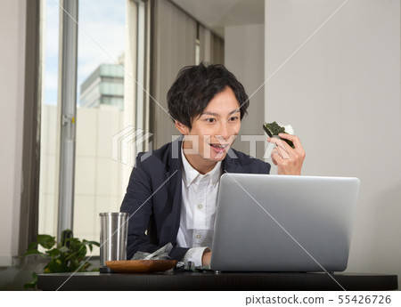 Surprised businessman looking at personal computer screen Surprised businessman looking at personal computer screen 55426726