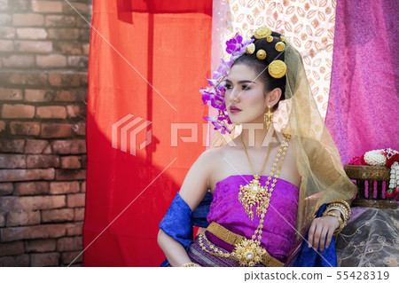 Thai woman wearing thai traditional clothing. Thai woman wearing thai traditional clothing. 55428319
