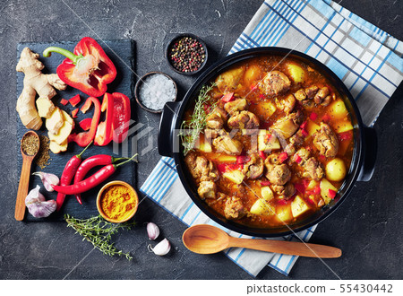 chicken curry in a black pan, top view chicken curry in a black pan, top view 55430442