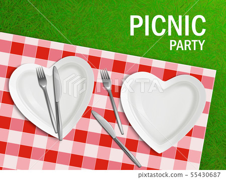 Heart shaped plate on tablecloth and green grass 55430687