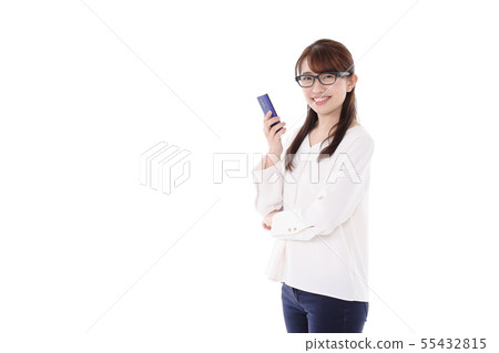 Young woman looking at a smartphone Young woman looking at a smartphone 55432815