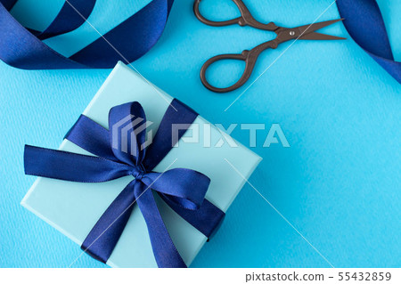Image of blue ribbon present Image of blue ribbon present 55432859