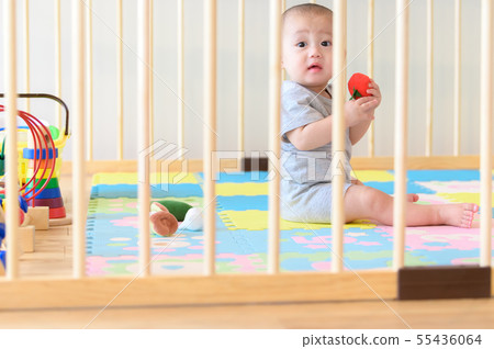 Baby playing in a baby circle Baby playing in a baby circle 55436064