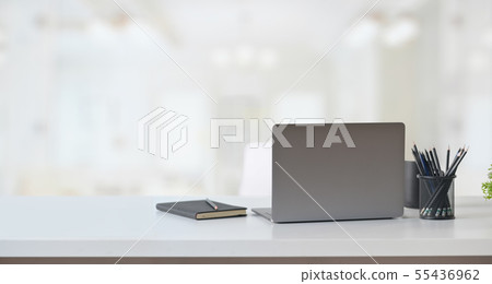Laptop computer on table in office workspace. Laptop computer on table in office workspace. 55436962