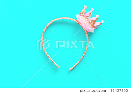 Pink and gold princess crown headband on blue 55437290