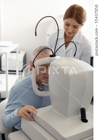Top view of grey-haired man visiting professional ophthalmologist 55437858