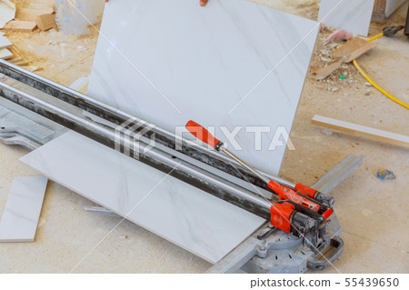 Cutting worker working with floor tile cutting 55439650