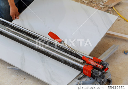 industrial tiler builder working with floor tile industrial tiler builder working with floor tile 55439651