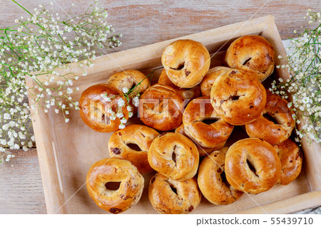 Buns with raisins wood background 55439710