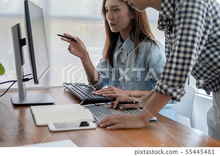 Programmer working in a software development and Programmer working in a software development and 55445481