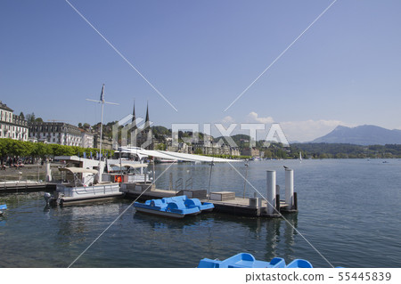 Emptie docks of Lake Lucerne under blue sky  55445839