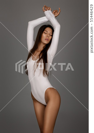 beautiful perfect woman in white bodysuit beautiful perfect woman in white bodysuit 55446429