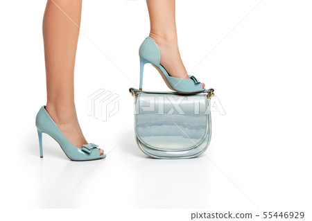 Woman in high heels shoes with blue handbag Woman in high heels shoes with blue handbag 55446929