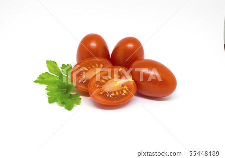 Red tomatoes on white background. Green parsley Red tomatoes on white background. Green parsley 55448489
