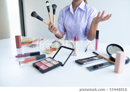 woman showing beauty cosmetic product woman showing beauty cosmetic product 55448918