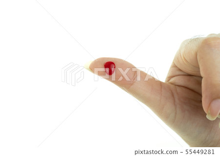 Bleeding red blood from the cut finger wound at wh 55449281