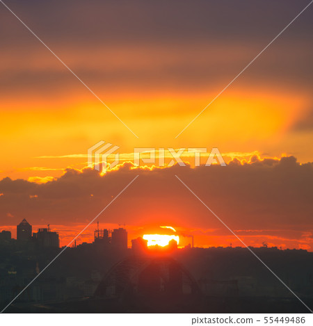 Sunset in the city with silhouette of buildings Sunset in the city with silhouette of buildings 55449486