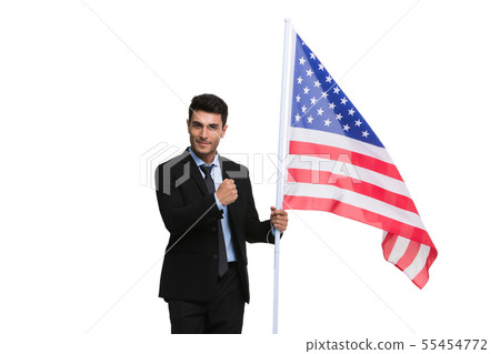 Businessman holding an American flag.. Businessman holding an American flag.. 55454772