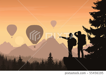 Two hikers looking down into the valley between 55456195