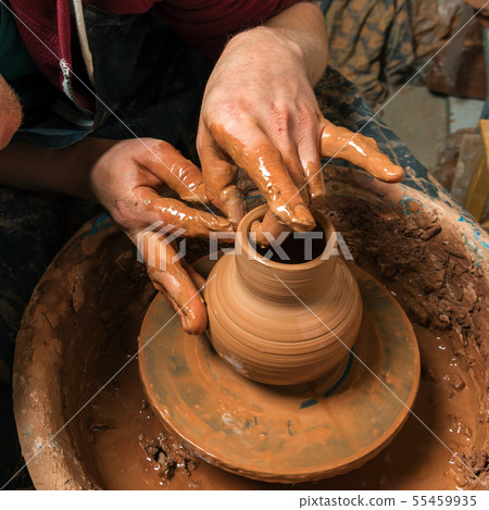 Potter at work. Workshop. 55459935