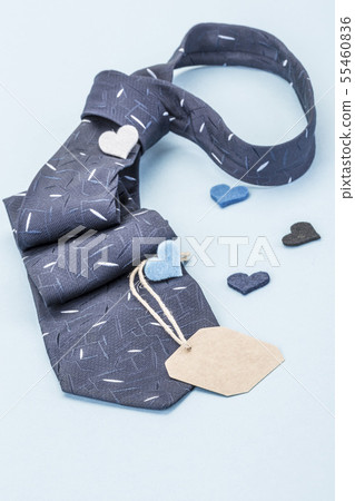 Dark blue tie and small hearts with a name tag 55460836