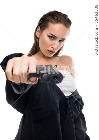 Beautiful brunette in sexy top with a gun shot Beautiful brunette in sexy top with a gun shot 55463539