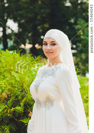 Beautiful Middle Eastern Arabic girl having happy time in nature. Beautiful Middle Eastern Arabic girl having happy time in nature. 55464043