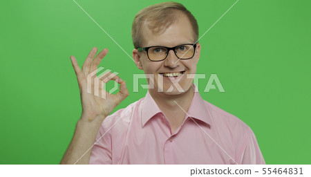 Caucasian man in pink shirt showing OK gesture. Chroma key Caucasian man in pink shirt showing OK gesture. Chroma key 55464831