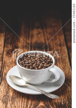 Roasted coffee beans in white cup 55465183