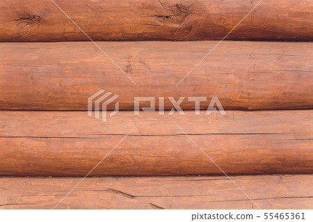 wooden wall from round logs close-up brown. wooden wall from round logs close-up brown. 55465361