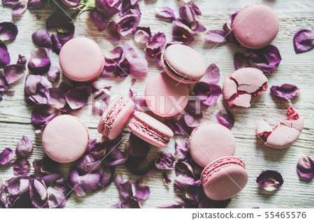 Sweet pink macaron cookies and lilac rose petals Sweet pink macaron cookies and lilac rose petals 55465576