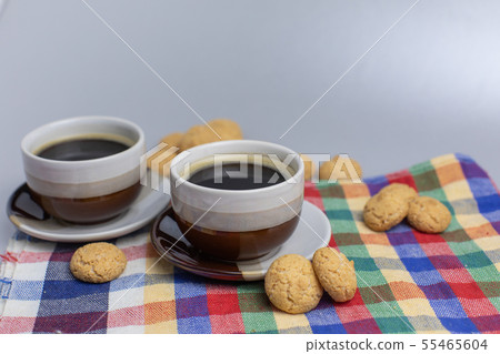 Cookie and two cups of coffee. Kruidnoten, pepernoten, strooigoed 55465604