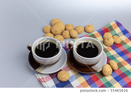 Cookie and two cups of coffee. Kruidnoten, pepernoten, strooigoed 55465616